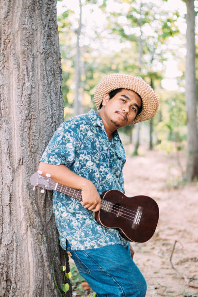 istock Happy farmer play ukulele 1181371312