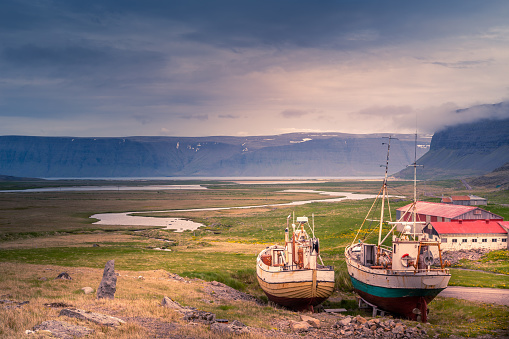 Oldest steel ship in Iceland abandoned rusty ashore in the grass, West Fjords, Iceland
