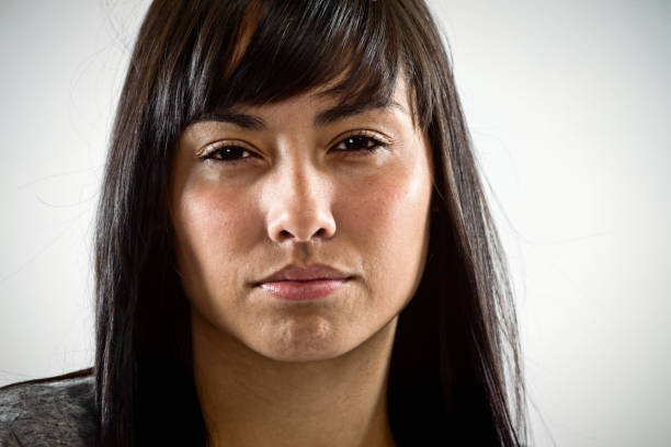 istock Beautiful brunette stares angrily at camera 1181373761