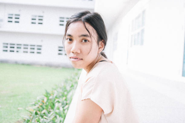 istock pretty Thai girl feeling lonely 1181375056