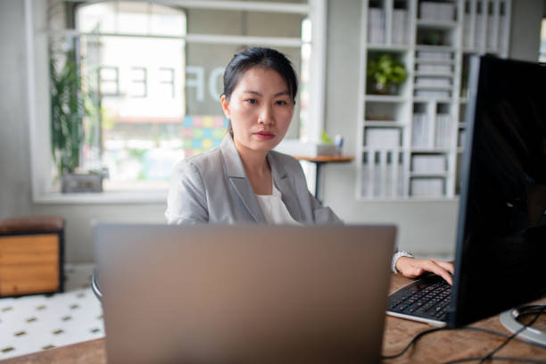 istock Young confident business woman in a modern office 1181377006