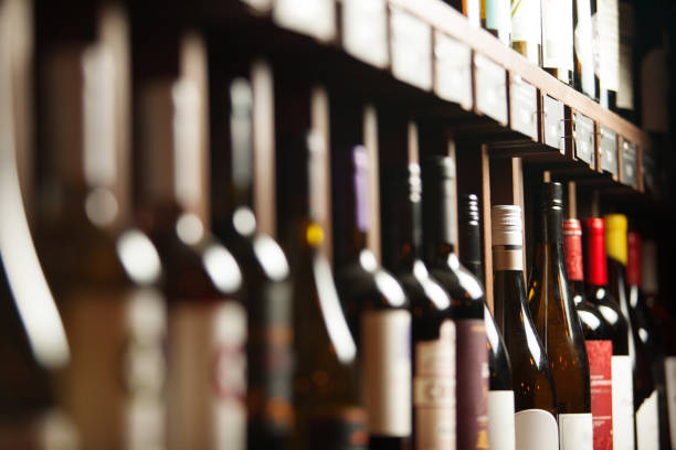 istock Wine cellar with elite drinks on shelves with written names 1181377225
