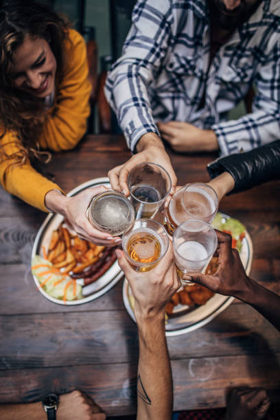 istock Friends having a toast in pub 1181378794