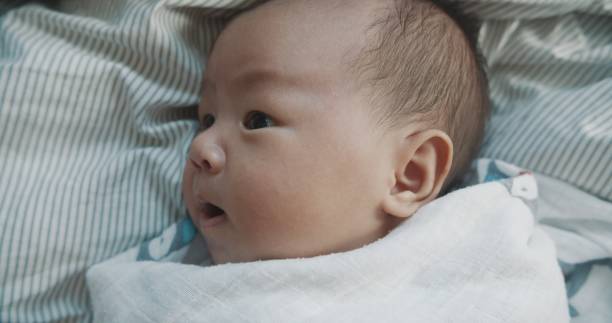 istock Cute Baby Boy In Blanket 1181378840