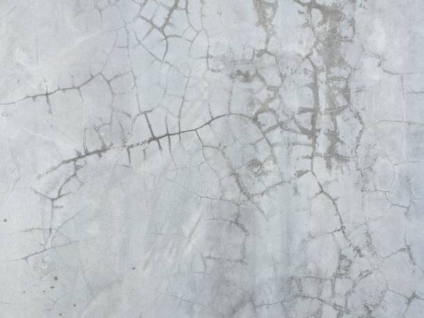 istock Cracked wall of cement background 1181379722