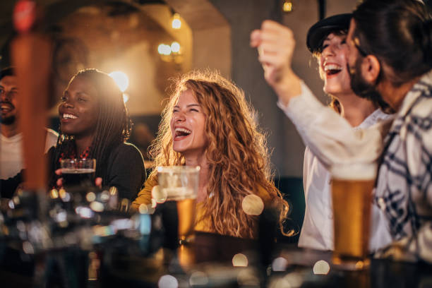 istock Happy friends at the bar 1181380250