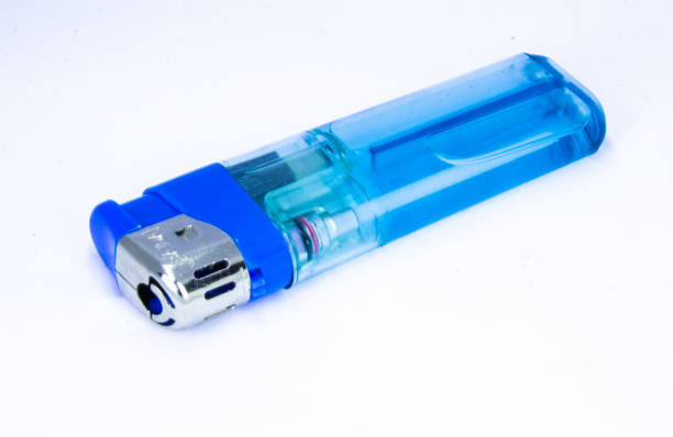 istock Red plastic gas lighter. Gas lighter isolated on white background. Closeup shot, top view 1181380332