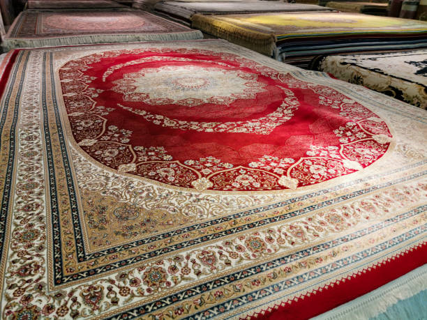 istock Multicolored Persian carpets or rugs or floor mats at display in shop 1181380363