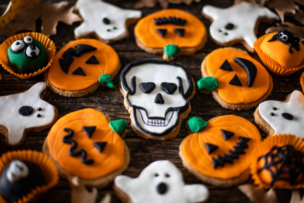 istock Halloween gingerbread cookies on the wooden table 1181381538
