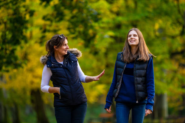 istock People walking in city park 1181381698