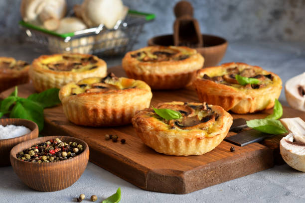 istock Puff pastry cake with mushrooms on a concrete background. 1181381794