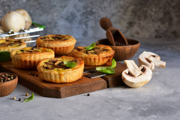 istock Puff pastry cake with mushrooms on a concrete background. 1181381798