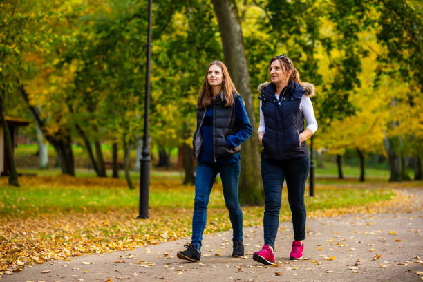istock People walking in city park 1181381815
