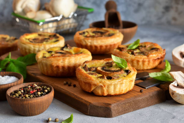 istock Puff pastry cake with mushrooms on a concrete background. 1181381885