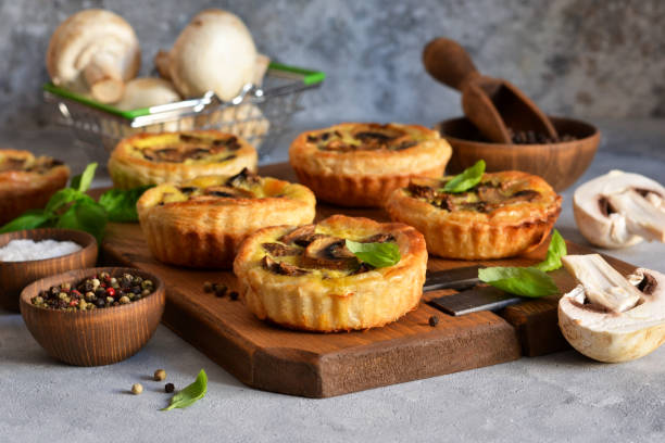 istock Puff pastry cake with mushrooms on a concrete background. 1181381922