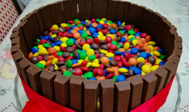 _ chocolate cake with pebbles._ broken chocolate bar. _ is a chocolate biscuit bar. Bar, biscuit, break.With clipping path