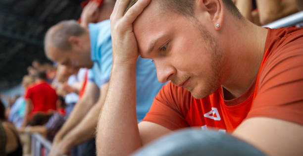 istock Sad fan in stadium 1181383828
