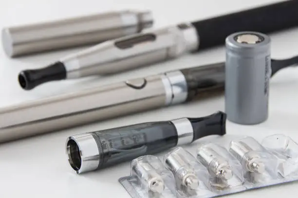 E-cigarette equipment on white background close-up