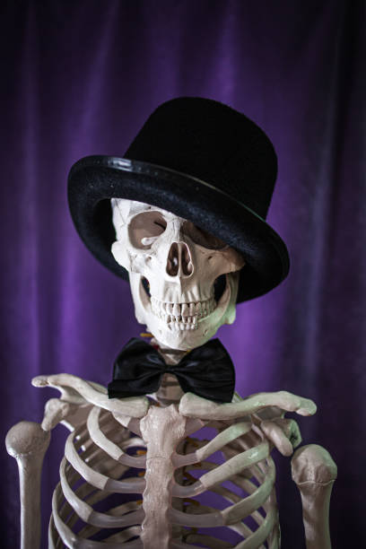istock Funny human skeleton in a bowler hat. 1181386289