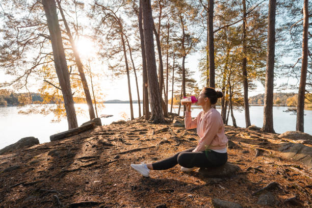 istock Woman drinking a protein shake after outdoor workout 1181386585