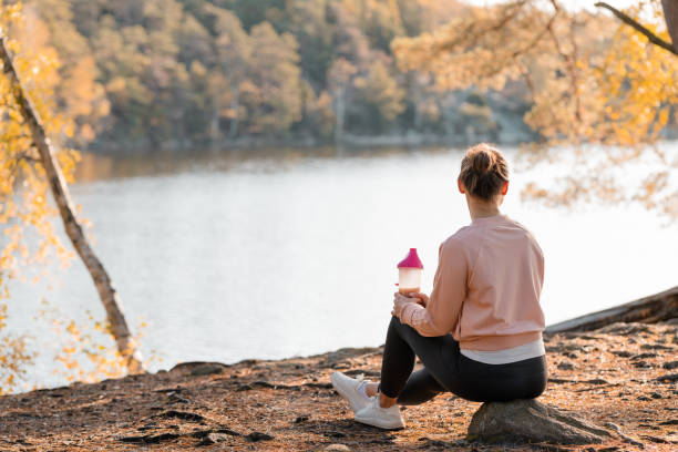 istock Woman drinking a protein shake after outdoor workout 1181386592