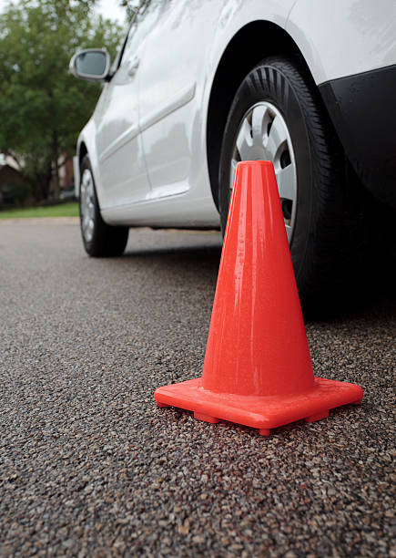 istock traffic cone next to stalled vehicle 118138785