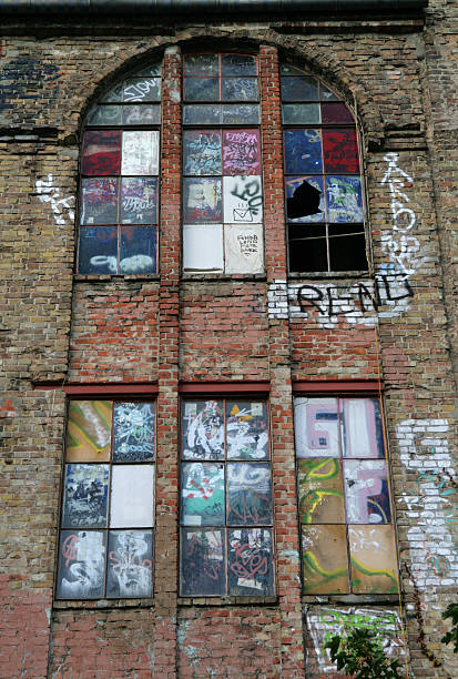 istock Graffiti on old brick wall and windows in Berlin Germany 118138844