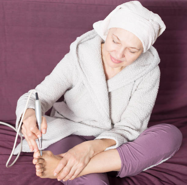 istock Woman doing pedicure 1181389184