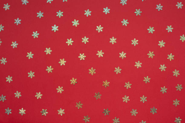 istock Red abstract Christmas background with holographic glitter snowflake 1181390574