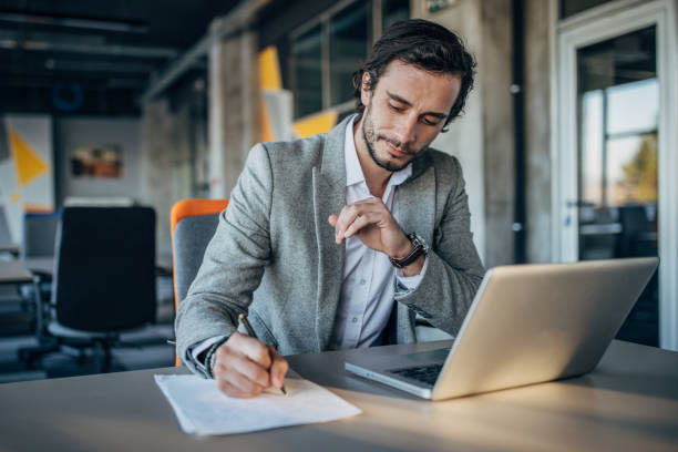 istock Modern businessman working in office 1181390975