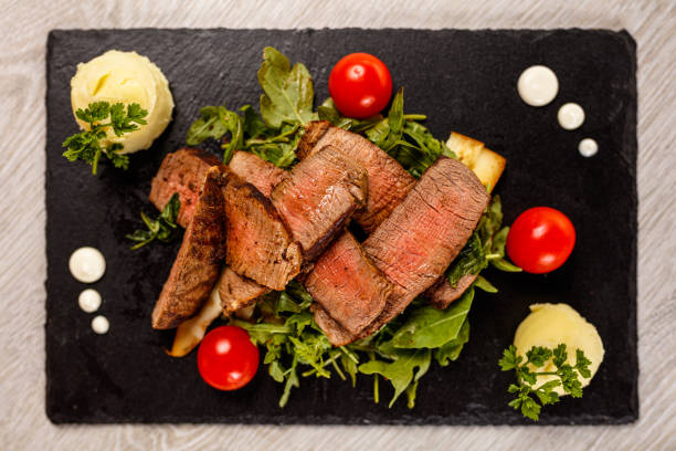 Delicious Tagliata Steak on granite board