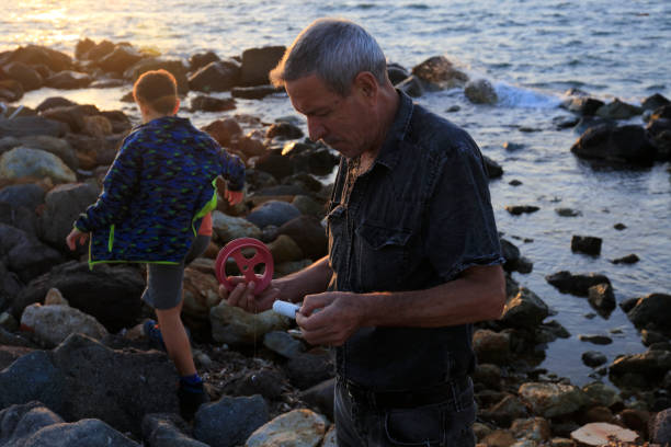 istock Getting the fishing reel ready 1181392891