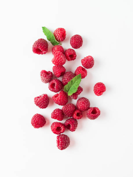 istock Heap of raspberry on white, copy space right 1181393987