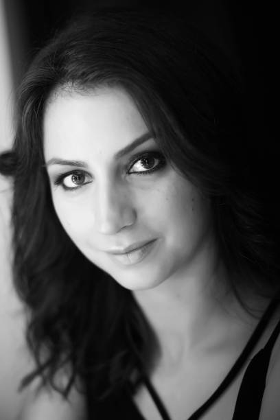 istock Girl doing makeup black and white 1181395427