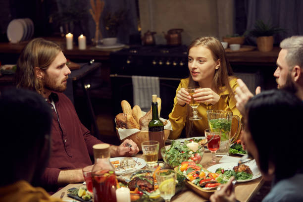 istock Friends Enjoying Dinner Party 1181395696