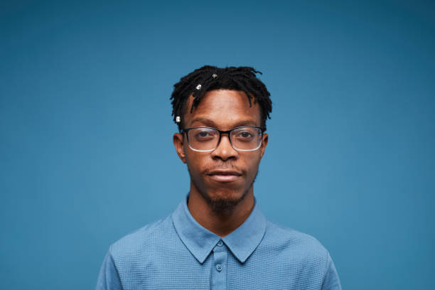 istock Contemporary African Man Posing on Blue 1181396790