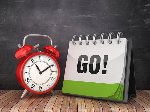 GO! Calendar with Alarm Clock on Chalkboard Background - 3D Rendering