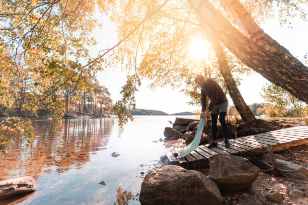 istock Man with a beard doing yoga outdoors on an autumn day 1181399246