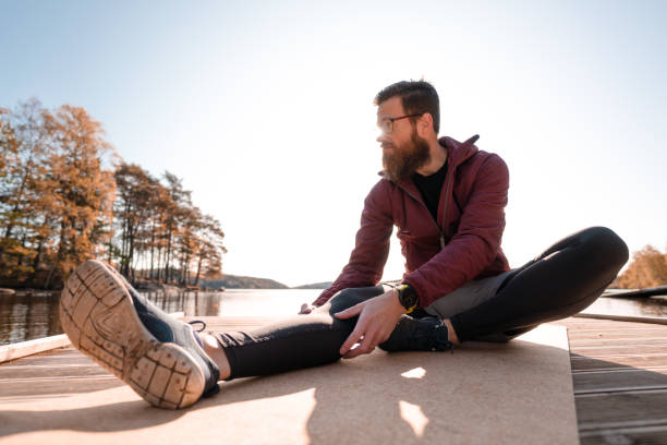 istock A man stretching and exercising outdoors in autumn 1181399250