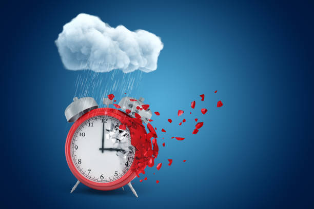 istock 3d rendering of red alarm clock standing under raining cloud and dissolving in particles on one side, on blue background with copy space. 1181399354