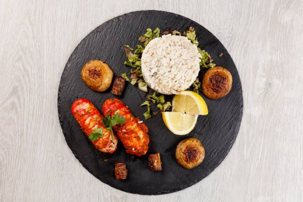 istock Lobster Tails served on granite plate 1181399455