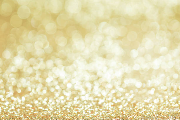 istock Shiny golden lights background 1181402311