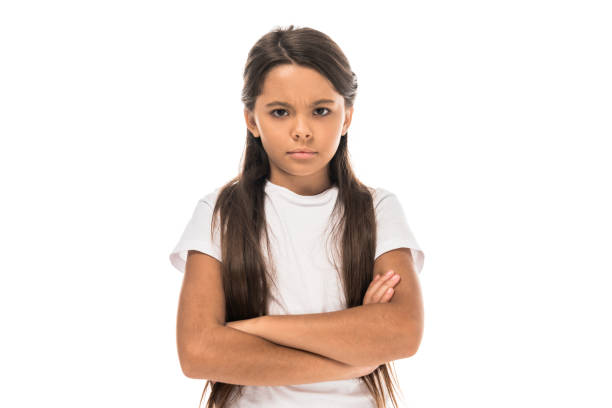 istock sad kid standing with crossed arms isolated on white 1181403768