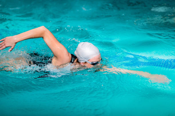 istock Recreational Front Crawl Swimming in The Pool. 1181404667