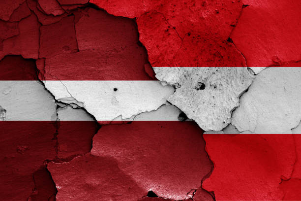 istock flags of Latvia and Austria painted on cracked wall 1181405123