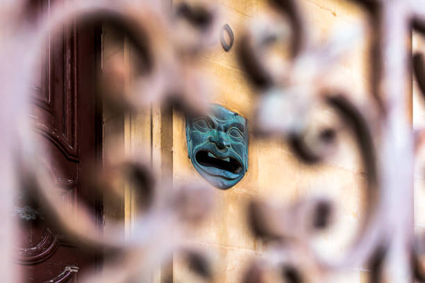 Close up face gypsum copy antique sculpture with craquelure . Red green duotone lighting effect.