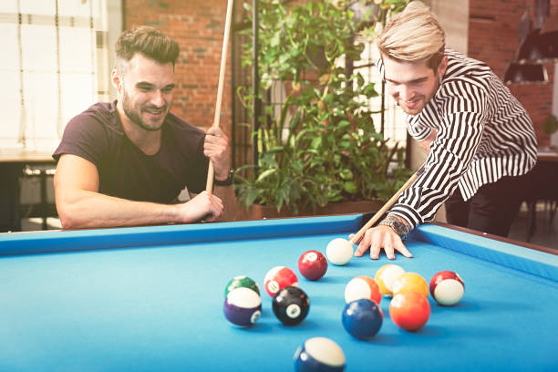 istock Employees playing in billiards at office 1181406805