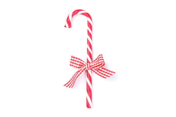 istock Sweet candy cane with bow isolated on white background 1181406991