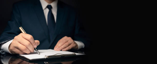 Lawyer, notary, attorney signs document