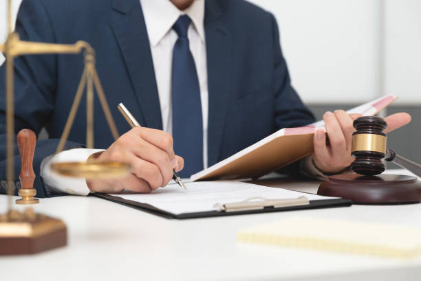 istock Lawyer or attorney working with papers in office 1181407096